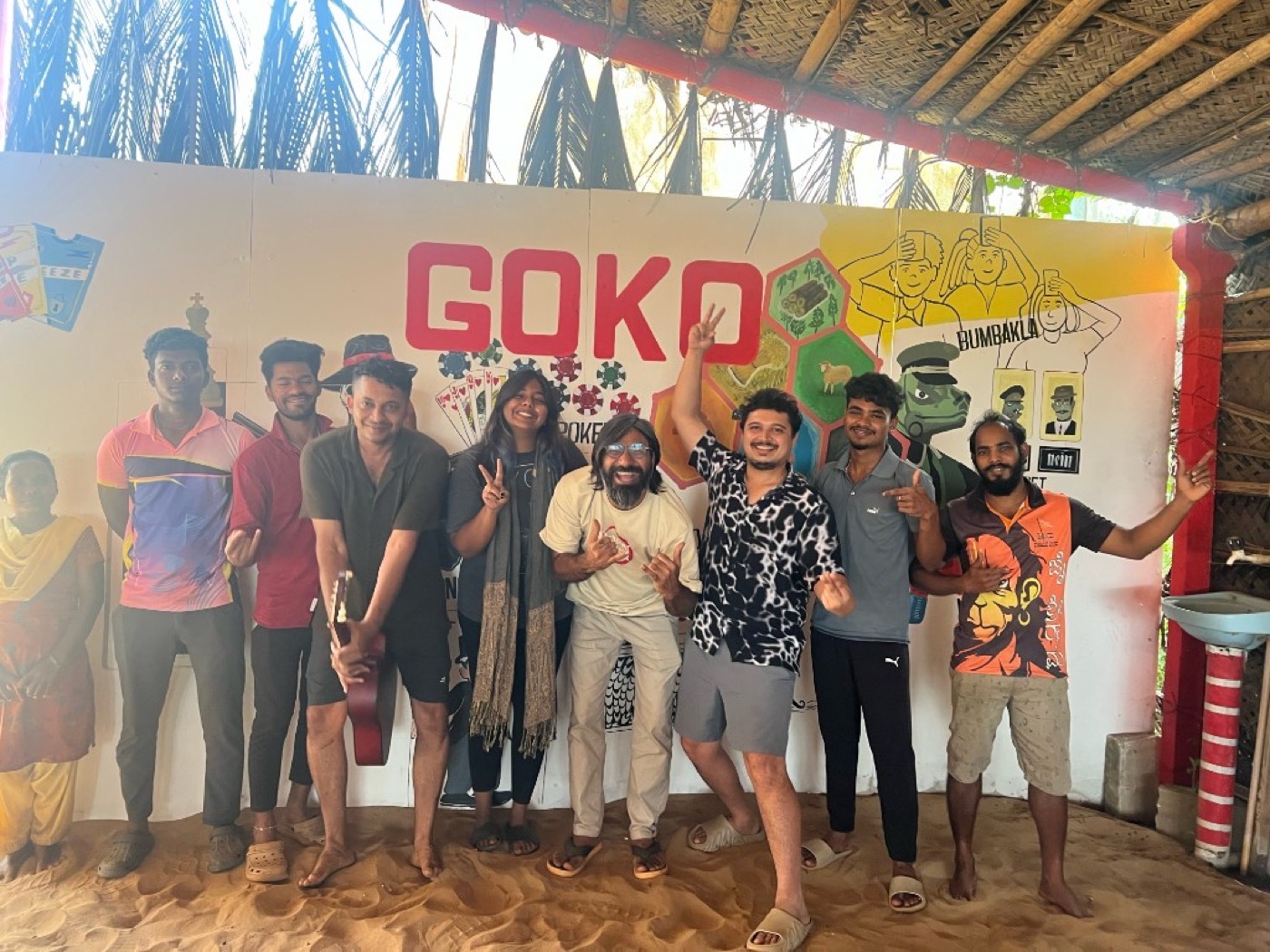 Goko community — team and guests by the GOKO mural