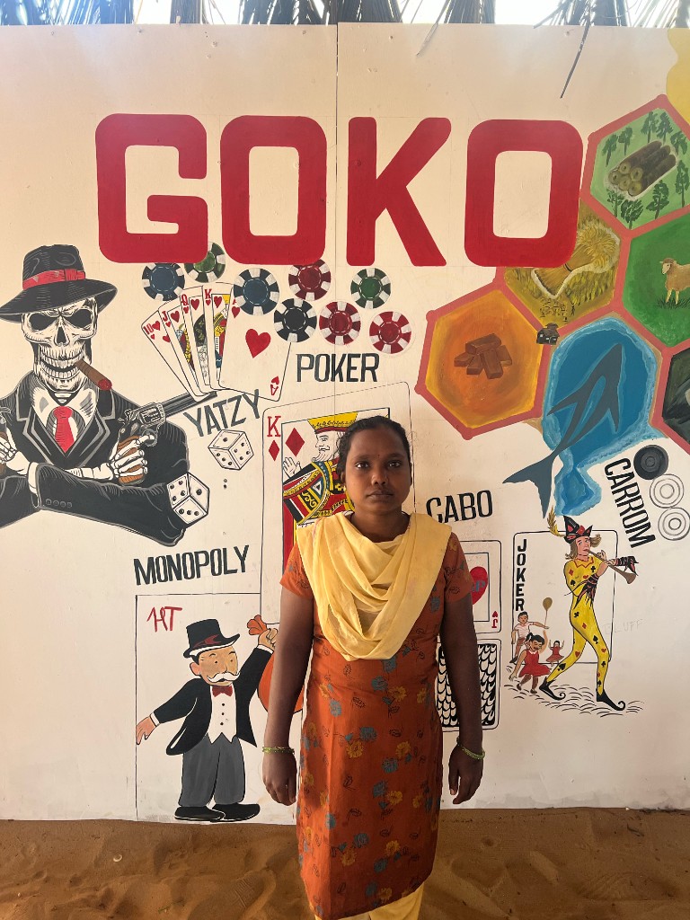 Housekeeping lead in front of the GOKO mural