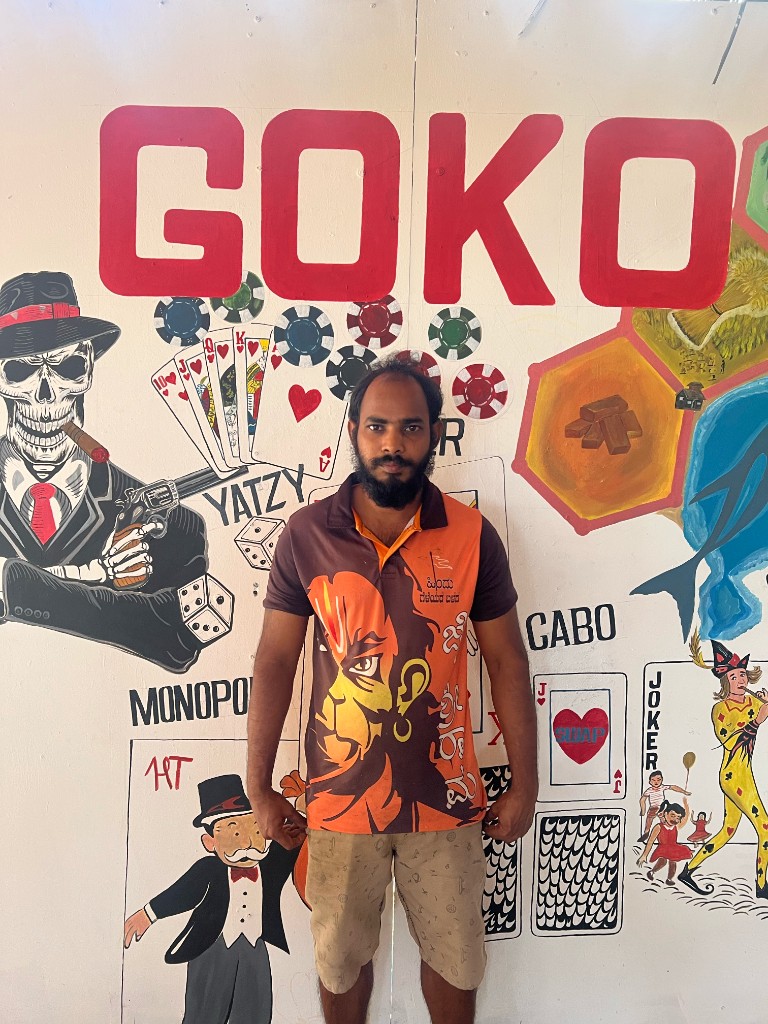 Yeshvant in front of the hand-painted GOKO games mural